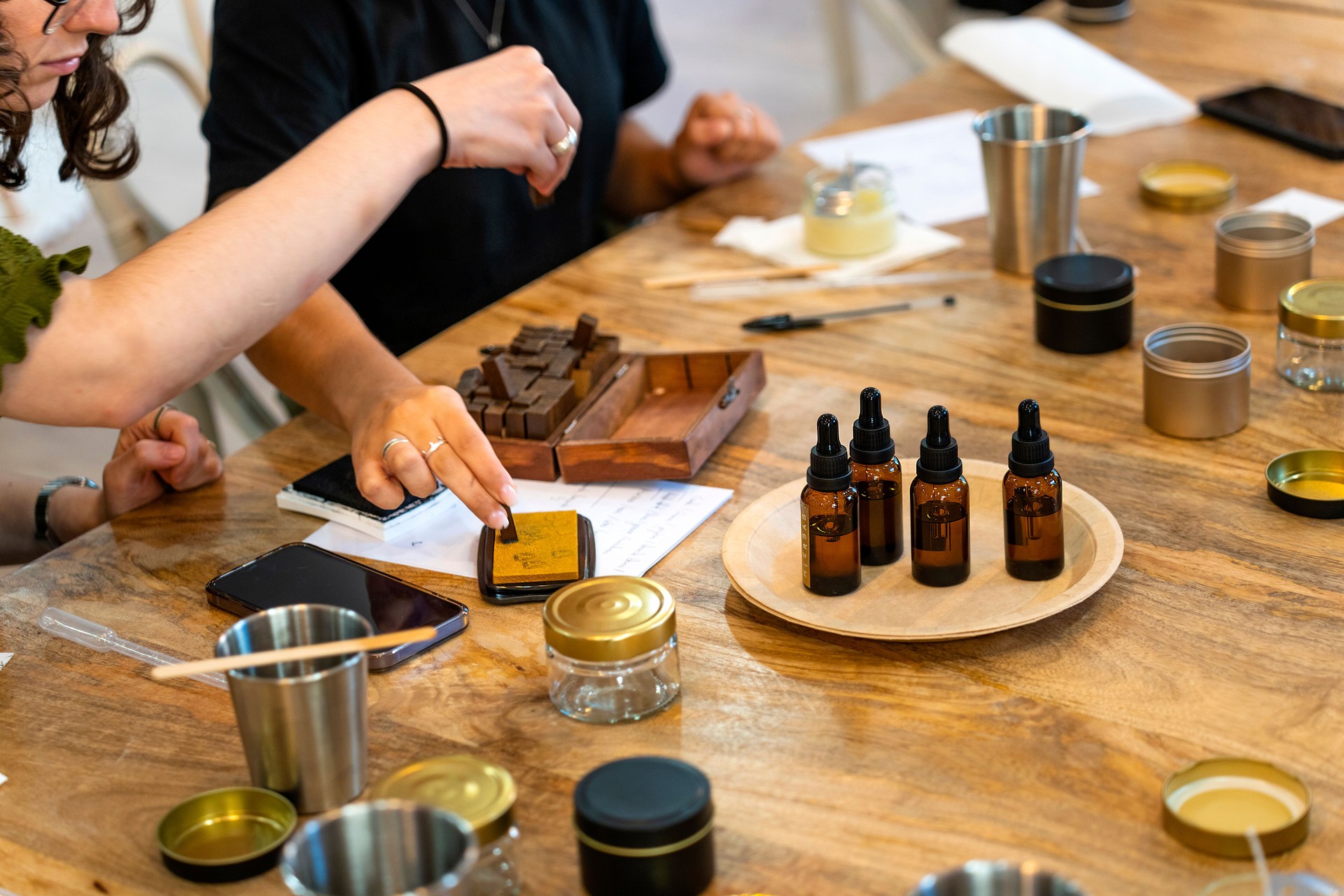 Aromatic candle workshop. Women working on their candle.